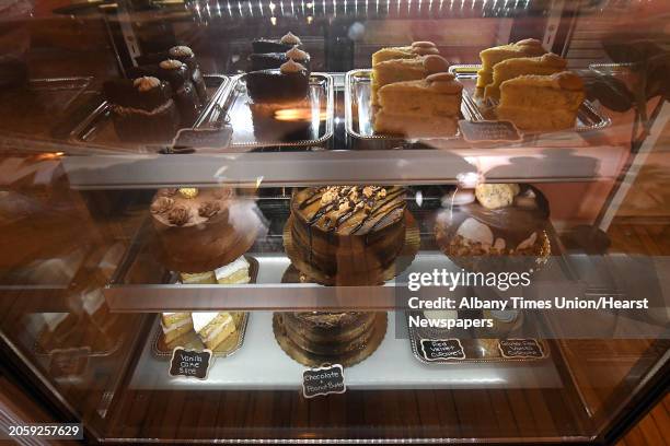 Cakes are seen on shelves during a grand opening of Nelly's Treats, a new bakery that offers treats for dogs and humans alike on Friday, July 9, 2021...