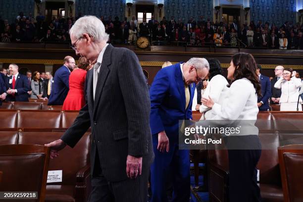 Senate Minority Leader Mitch McConnell and Senate Majority Leader Chuck Schumer arrive on the House floor ahead of the annual State of the Union...