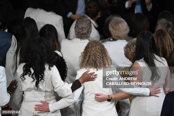 Democratic US Representatives dress in white to call attention to women's rights on the floor of the House of Representatives ahead of US President...