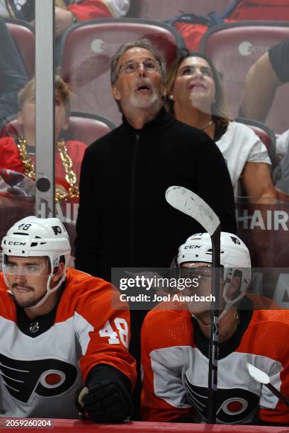 Head coach John Tortorella of the Philadelphia Flyers watches a replay during second period action against the Florida Panthers at the Amerant Bank...