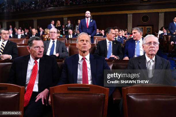 Republican Senators John Barrasso from Wyoming and John Thune from South Dakota sit next to Senate Minority Leader Mitch McConnell in the House of...
