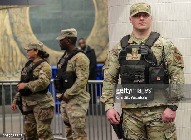 Security forces, including National Guard troops and police, take security measures at a subway station in New York, United States on March 07, 2024....