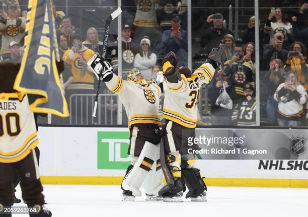 Jeremy Swayman and Linus Ullmark of the Boston Bruins celebrate a 4-1 victory against the Toronto Maple Leafs at the TD Garden on March 7, 2024 in...