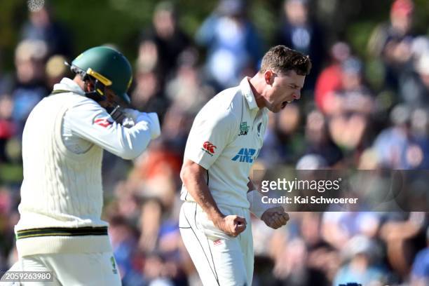 Matt Henry of New Zealand celebrates after dismissing Usman Khawaja of Australia during day one of the Second Test in the series between New Zealand...