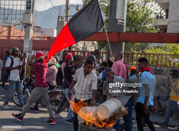 People People set tires on fire during a demonstration demanding the resignation of Haitian Prime Minister Ariel Henry as Haiti's government extended...