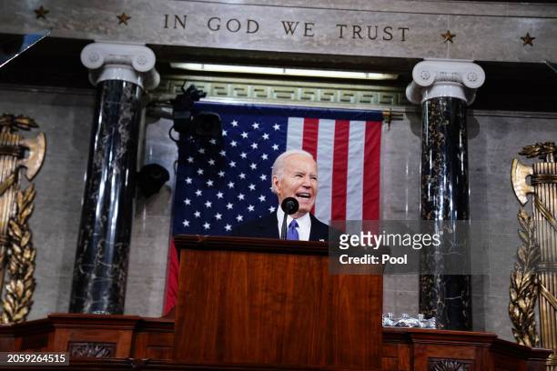 President Joe Biden delivers his annual State of the Union address before a joint session of Congress in the House chamber at the Capital building on...