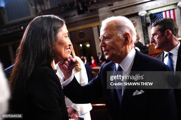 President Joe Biden gestures to US Secretary of the Interior Debra Haaland after delivering his State of the Union address in the House Chamber of...