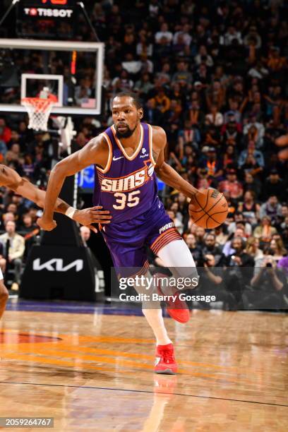Kevin Durant of the Phoenix Suns handles the ball during the game against the Toronto Raptors on March 7, 2024 at Footprint Center in Phoenix,...
