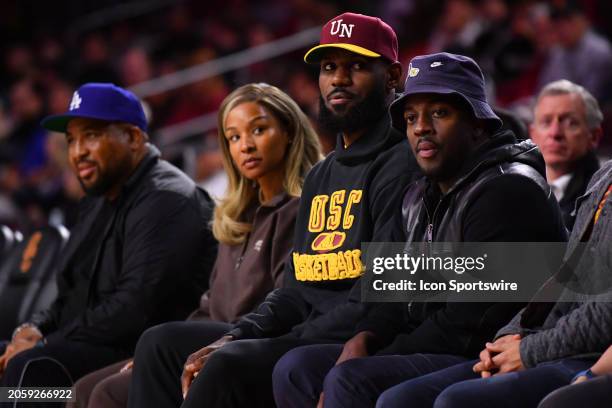 Lebron James and his wife Savannah James look on during the college basketball game between the Arizona State Sun Devils and the USC Trojans on March...