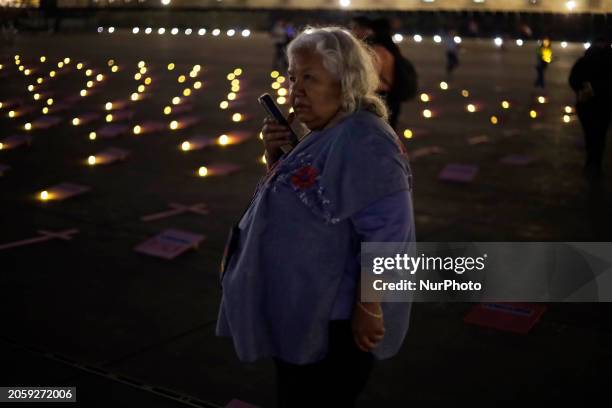 Irinea Buendia, the mother of a femicide victim, is protesting in the Zocalo of Mexico City, during an evening before the International Women's Day...