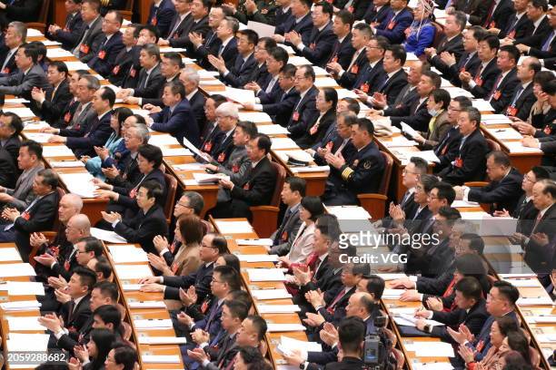 Members of the 14th National Committee of the Chinese People's Political Consultative Conference attend the opening meeting of the second session of...