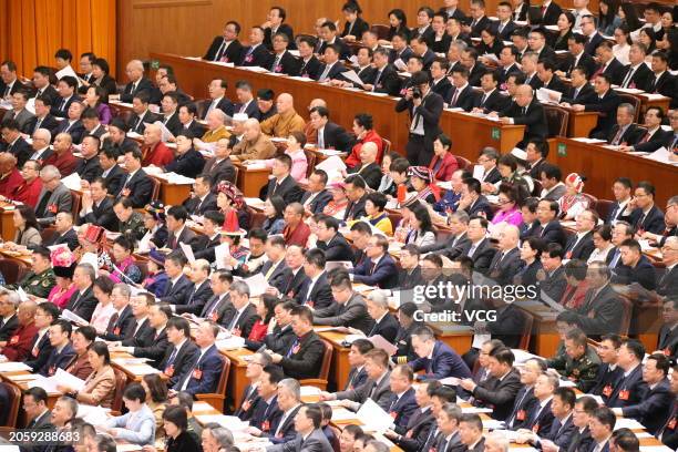 Members of the 14th National Committee of the Chinese People's Political Consultative Conference attend the opening meeting of the second session of...