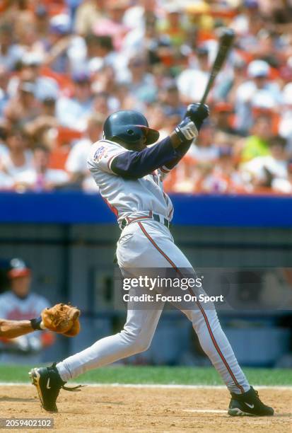 Michael Tucker of the Atlanta Braves bats against the New York Mets during Major League Baseball game circa 1997 at Shea Stadium in the Queens...