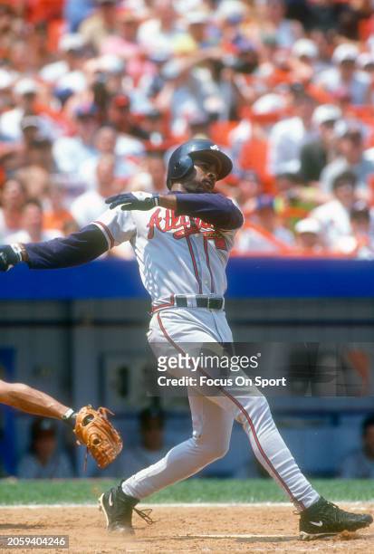 Michael Tucker of the Atlanta Braves bats against the New York Mets during Major League Baseball game circa 1997 at Shea Stadium in the Queens...