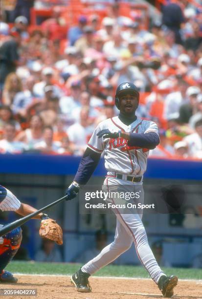 Michael Tucker of the Atlanta Braves bats against the New York Mets during Major League Baseball game circa 1997 at Shea Stadium in the Queens...