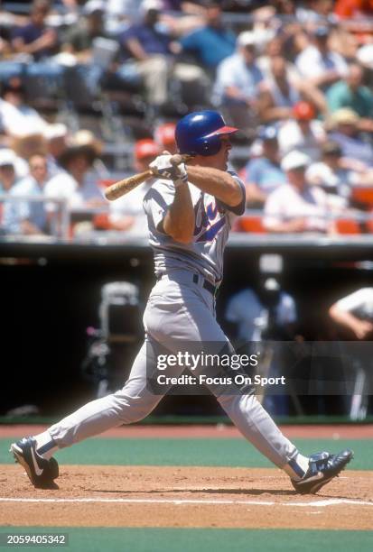 Rick Wilkins of the Chicago Cubs bats against the Philadelphia Phillies during a Major League Baseball game circa 1995 at Veterans Stadium in...