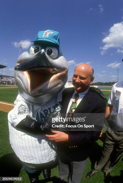 Wayne Huizenga owner of the Miami Marlins seen in this photo with mascot Billy the Marlin prior to the start of a Major League Baseball spring...