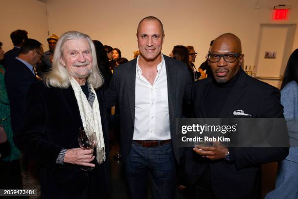 Don Padgett, Nigel Barker and Madison Cowan attend the CARE International Women's Day: She Leads the World Portrait Gallery at Spring Studios on...