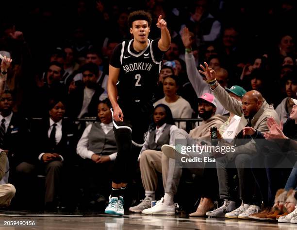 Cameron Johnson of the Brooklyn Nets celebrates his three point shot during the first half against the Memphis Grizzlies at Barclays Center on March...