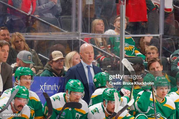 Minnesota Wild head coach John Hynes watches from the bench against the Vancouver Canucks during the game at the Xcel Energy Center on December 16,...