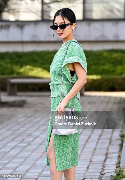 Chailee Son is seen wearing a green Stella McCartney sweater and skirt, silver bag and black sunglasses outside the Stella McCartney show during the...