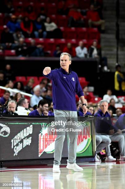 Head coach Chris Collins of the Northwestern Wildcats watches the game against the Maryland Terrapins at Xfinity Center on February 28, 2024 in...