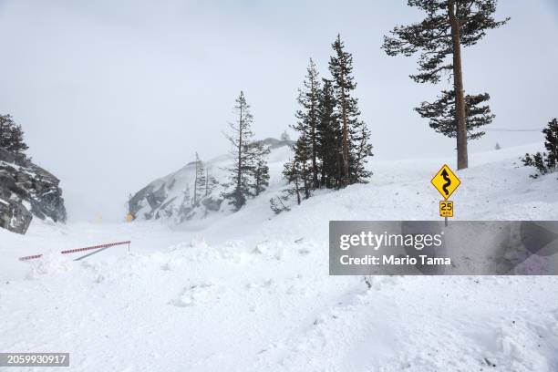 Donner Pass Road at Donner Summit is covered in snow following a massive snowstorm in the Sierra Nevada mountains on March 04, 2024 near Soda...