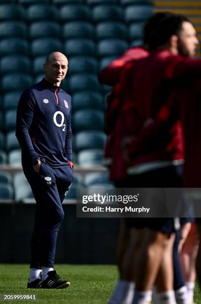 London , United Kingdom - 8 March 2024; England head coach Steve Borthwick watches a huddle during an England rugby captain's run at Twickenham...