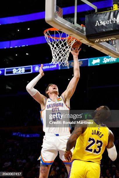 Mike Muscala of the Oklahoma City Thunder takes a shot against LeBron James of the Los Angeles Lakers in the second half at Crypto.com Arena on March...
