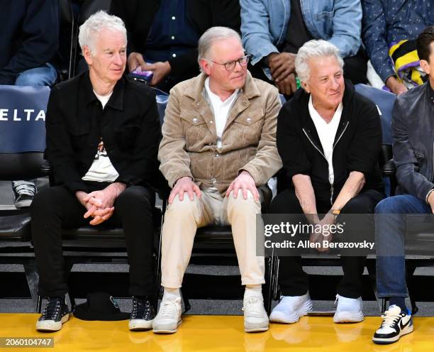 John McEnroe, David Zaslav, and Dustin Hoffman attend a basketball game between the Los Angeles Lakers and the Oklahoma City Thunder at Crypto.com...