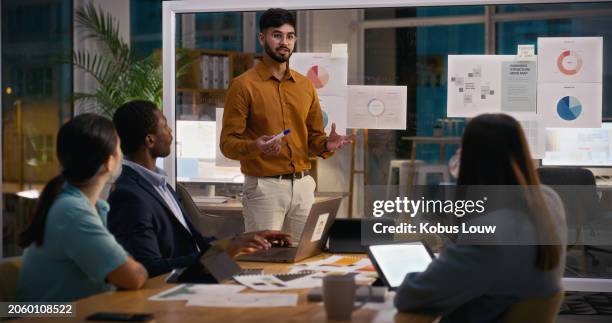 creative business people, night and man in presentation for meeting, ideas or strategy at office. staff, speaking or group of designers talking in team collaboration or sharing startup data analytics - palestra imagens e fotografias de stock
