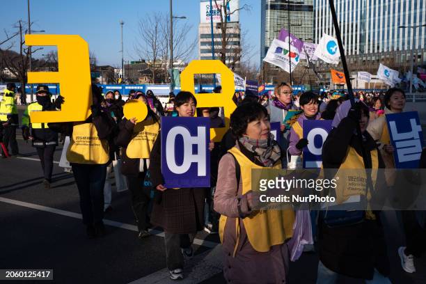 Participants are marching at Cheonggye Plaza in Seoul, South Korea, on March 8 holding pickets and chanting slogans during the 39th Korean Women's...