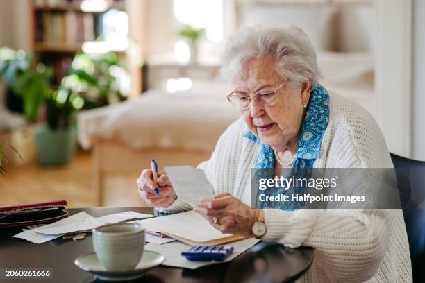 senior woman has financial problems. counting money, monthly pension, don’t have enough money for paying bills. - dont change stock pictures, royalty-free photos & images