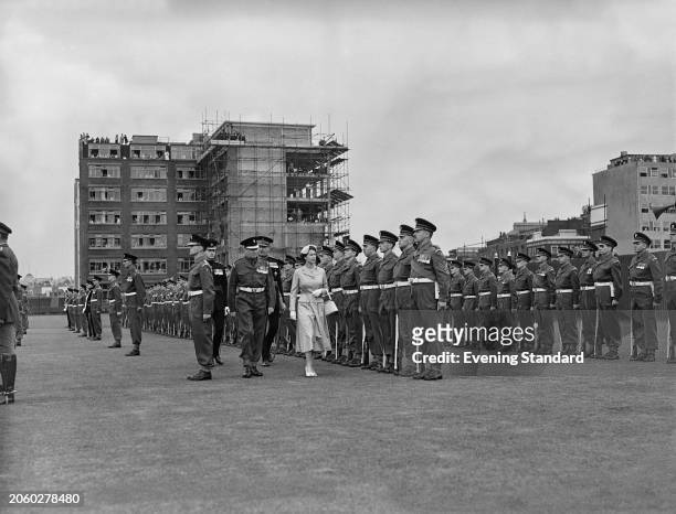 Queen Elizabeth II inspecting the Honourable Artillery Company's guard of honour on the parade ground at Armoury House in London, September 6th 1955....