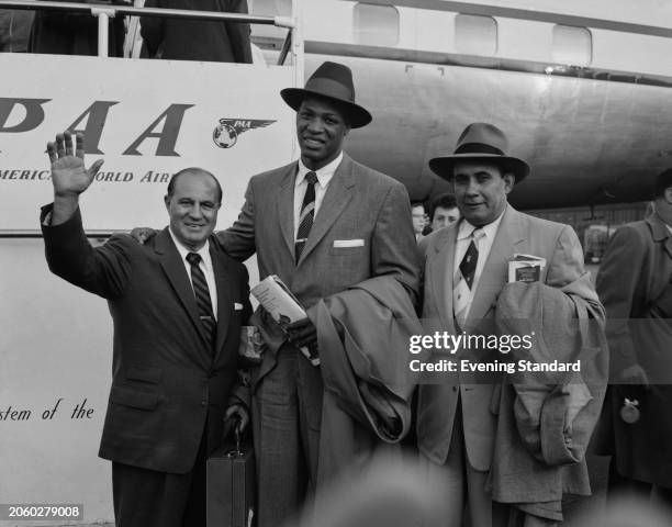 Cuban boxer Nino Valdes and former boxer Bobby Gleason arriving in London, September 9th 1955. Valdes is due to fight Don Cockell at White City...