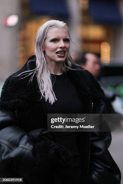 Julia Fox seen wearing black long dress and a black faux leather / black trim oversized coat, outside Vetements, during the Womenswear Fall/Winter...