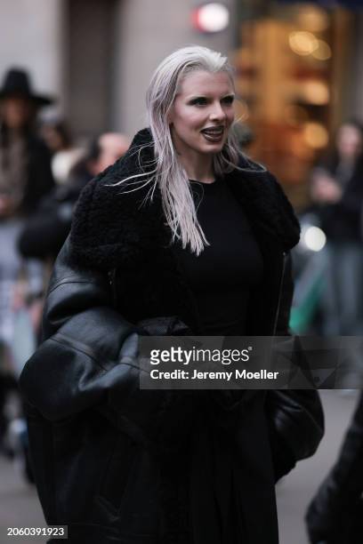 Julia Fox seen wearing black long dress and a black faux leather / black trim oversized coat, outside Vetements, during the Womenswear Fall/Winter...