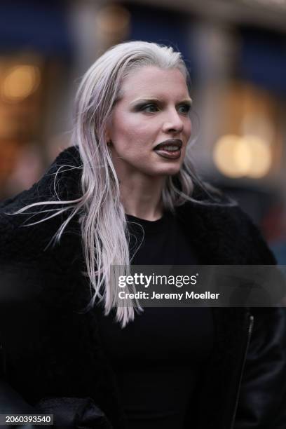 Julia Fox seen wearing black long dress and a black faux leather / black trim oversized coat, outside Vetements, during the Womenswear Fall/Winter...