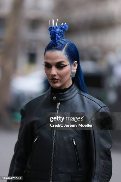 Sita Abellan seen wearing silver large earrings and a Vetements black leather biker jacket, outside Vetements, during the Womenswear Fall/Winter...