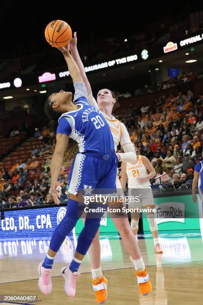 Kentucky Wildcats guard Amiya Jenkins and Tennessee Volunteers guard Sara Puckett reach for a rebound during the SEC Women's Basketball Tournament...