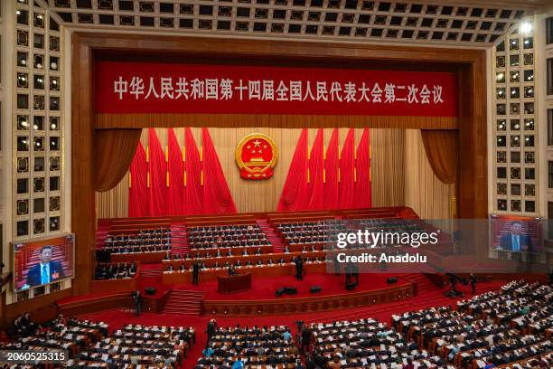 Delegates attend the second plenary session of the Second Session of the 14th National People's Congress at Tiananmen Square in Beijing, China on...