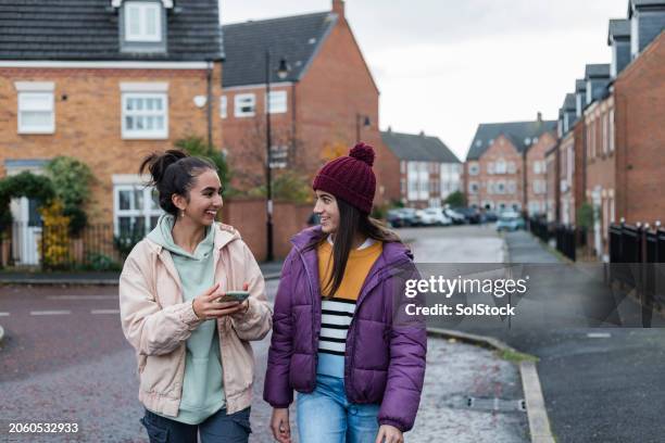 spending time with my sister - girl bobble hat stock pictures, royalty-free photos & images