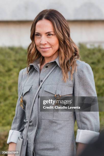 Melanie Jayne Chisholm wears grey jumpsuit, grey Stella McCartney crossbody bag, outside Stella McCartney, during the Womenswear Fall/Winter...