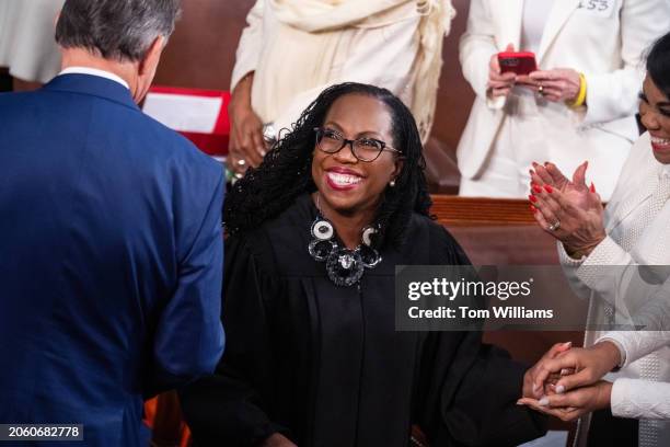 Supreme Court Justice Ketanji Brown Jackson and Sen. Joe Manchin, D-W.Va., arrive for President Joe Biden's State of the Union address in the House...
