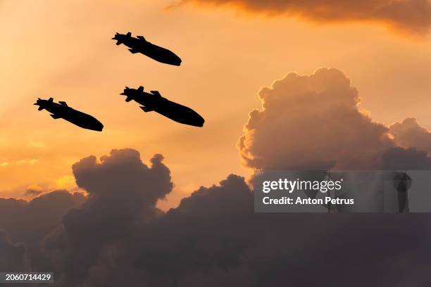 cruise missiles against the sunset sky - shelling stock pictures, royalty-free photos & images