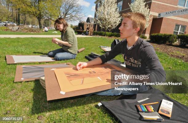 Amanda McIsaac of East Greenbush, and Andrew Parkes of Burnt Hills, take their beginning drawing class outside at Sage College of Albany in Albany,...