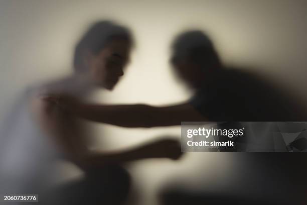 sad woman - partner violence stock pictures, royalty-free photos & images