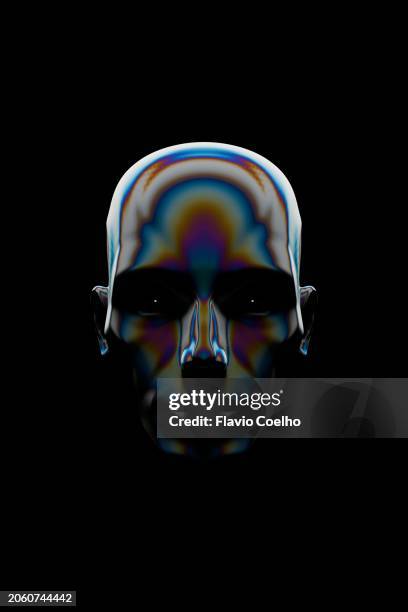 menacing robot face on black background - malvagità foto e immagini stock