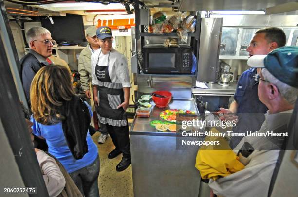 Scott Goss, BMC U.S. Coast Guard, second from right, gives a tour aboard the U.S. Coast Guard Cutter Sailfish at the Port of Albany in Albany, NY on...