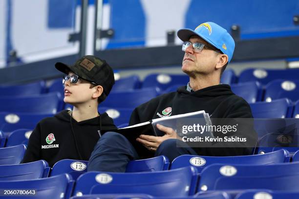 Head coach Jim Harbaugh of the Los Angeles Chargers watches from the stands during the NFL Combine at the Lucas Oil Stadium on March 2, 2024 in...